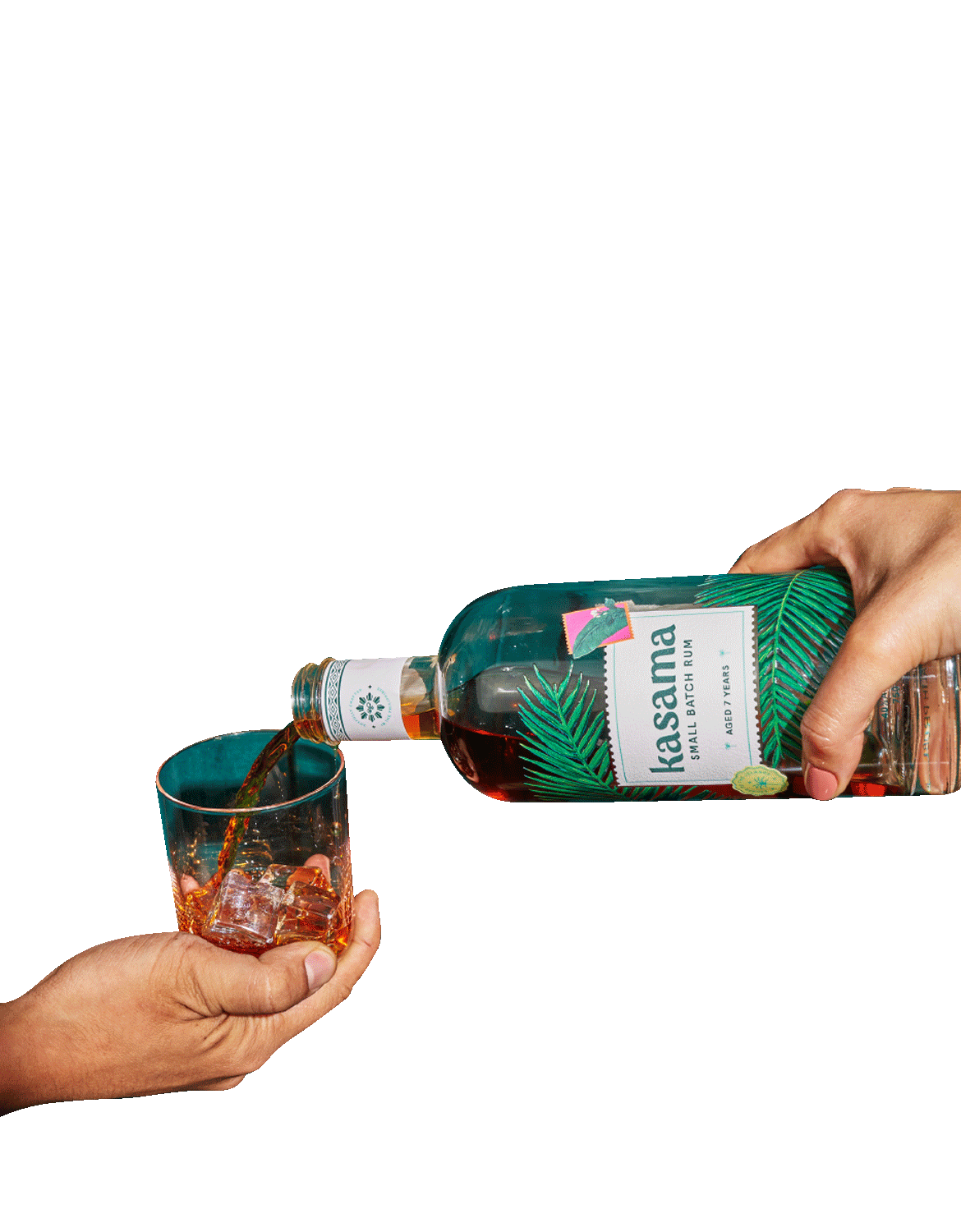 Pouring Kasama rum into a glass with ice.